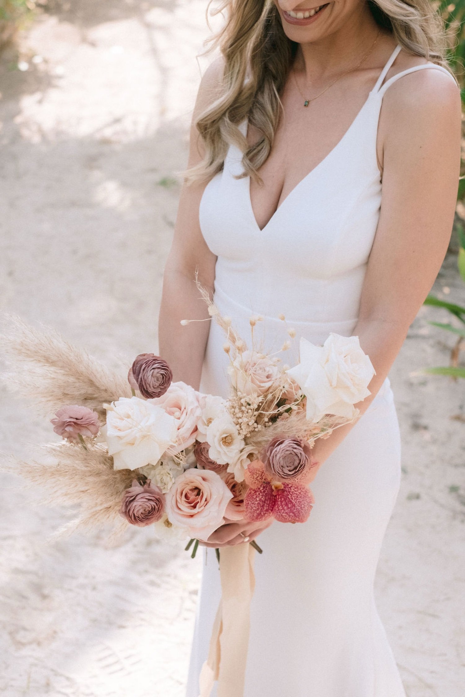 Bride-holding-her-bouquet-at-Akna-Tulum-wedding-venue,-candid-bridal-portrait-before-the-ceremony.jpg (1)